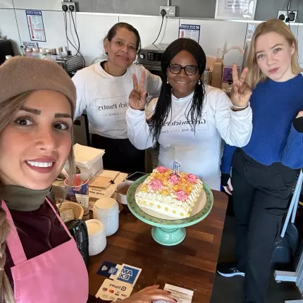 Image of employees smiling in kitchen