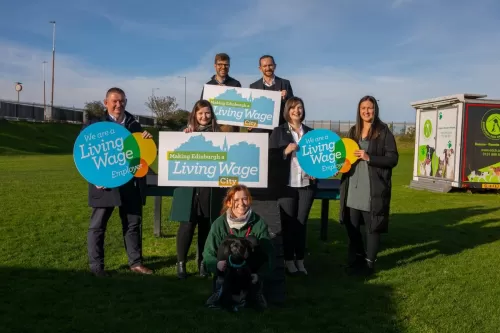 People standing with Living Wage Edinburgh sign