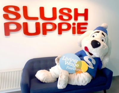 Slush puppie mascot with living wage logo