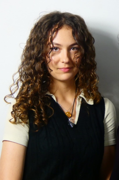 Headshot of Summer Scholes with a white background