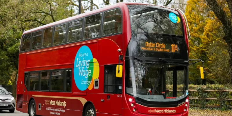 Living Wage logo on bus